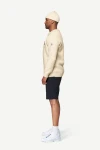 Devold Nansen Legacy Sweater, kolor: Raw White - prezentacja na modelu - bok