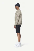 Devold Islender Refined Sweater, kolor: Raw White - prezentacja na modelu - bok
