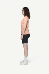 Devold Active Tee WMN, kolor: Sunrise - prezentacja na modelce - bok